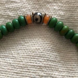 Turquoise beaded necklace with other semi precious stones 3 evil eye beads.